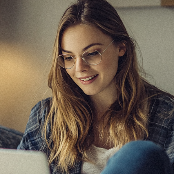 A woman studying level 2 and 3 combined bookkeeping course online from home